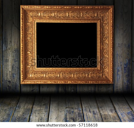 wooden grunge interior with antique picture frame