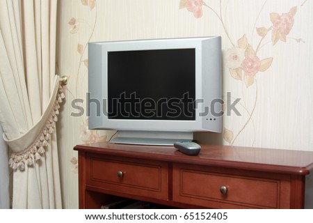 Modern television on wooden cabinet in the living room