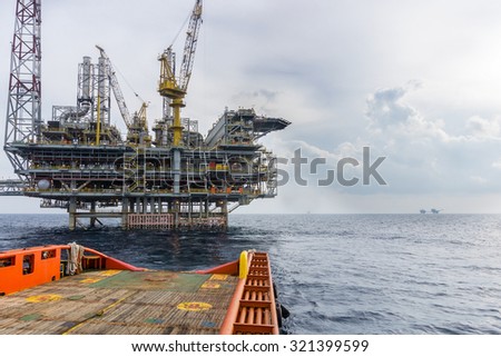 Supply boat leaving offshore rig
