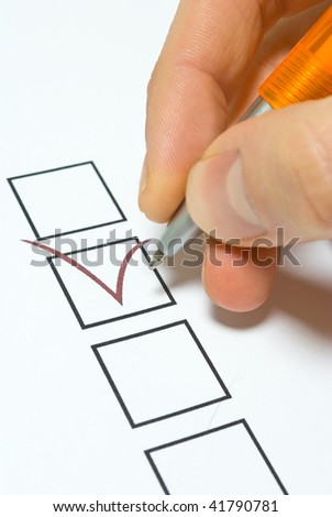 Hand with pen and check box