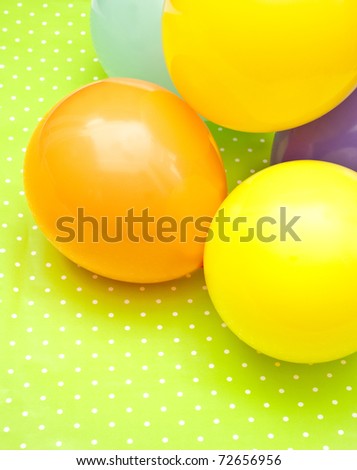 color balloons on the green background
