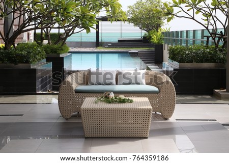 Modern roof top with sofa and furniture with pool.