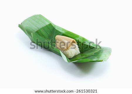 Sticky rice wrapped in banana custard thai candy thai food on white background