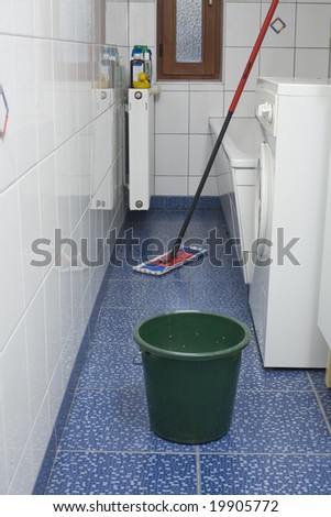 Cleaning and washing in a bathroom with white tiles