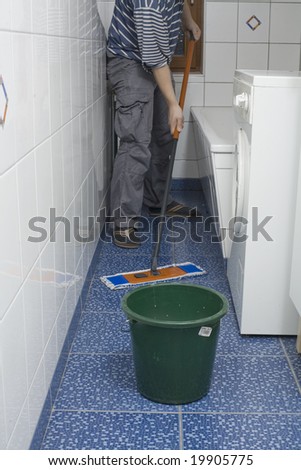 Cleaning and washing in a bathroom with white tiles