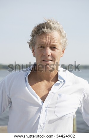 Portrait of mature adult man with grey hairs