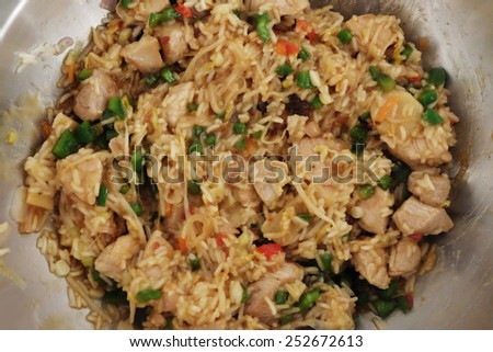 wok pan with rice, meat, paprika