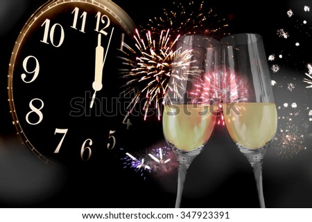 New Year's Eve - sparkling wine glasses and fireworks