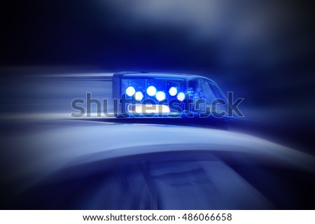 police car with blue lights switched on