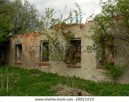 The wall and windows in ruined  old house.