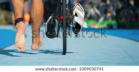 Triathlon bike the transition zone,detail of the bare feet
