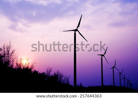 the wind turbine with the sunset
