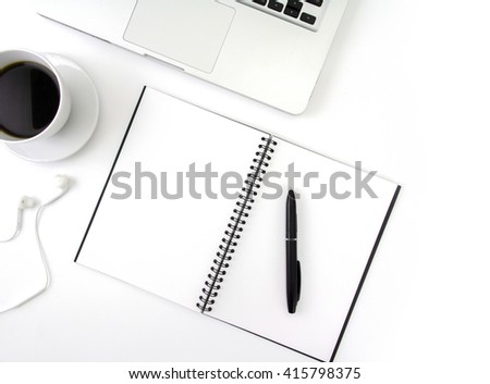 Creative flat lay photo of workspace desk with laptop, earphone, coffee and blank notebook with copy space background, minimal style
