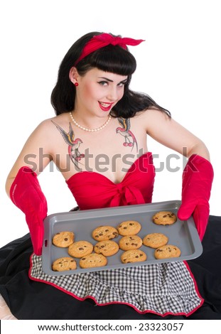 stock photo : Pretty 50's Pin Up style model in housewife clothing with 