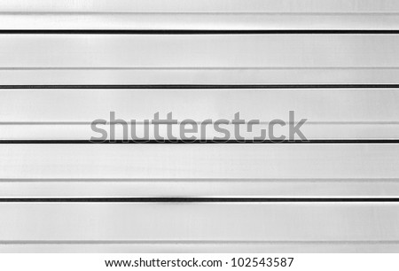 Close-up fragment metal background of bent metal sheet