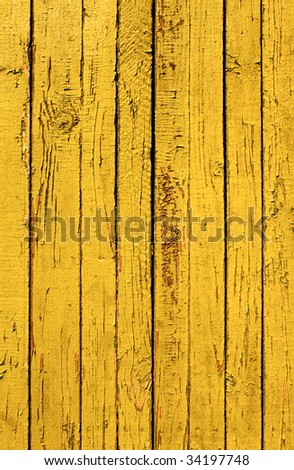 Grunge background from weathered yellow wooden plank
