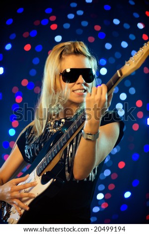 Beautiful female guitar player