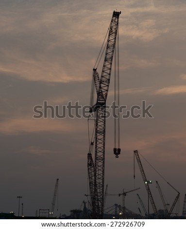 Construction cranes stopped for the evening.