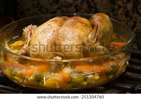 Oven baked chicken with pepper, onion and garlic