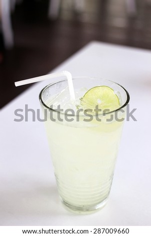 Lime soda with one sliced lime on the ice