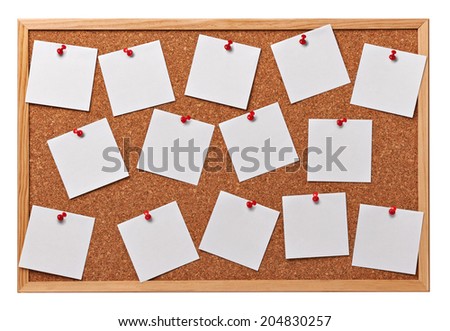 close up of note papers on a cork board