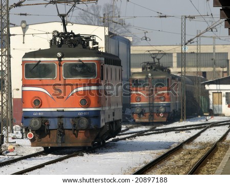 train engine moving through rail station