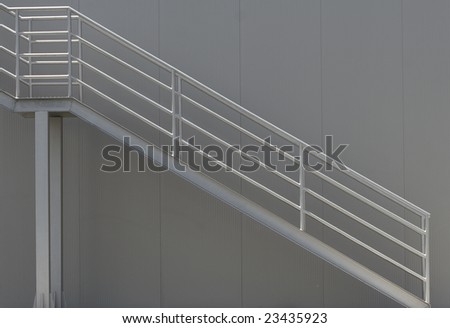 architectural detail of metal stairs and wall