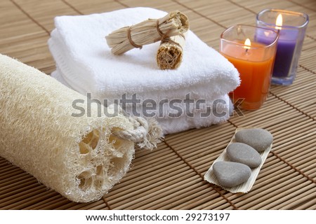 well being concept with towel, candle and plants