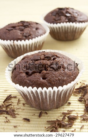 still life of chocolate muffins on kitchen table