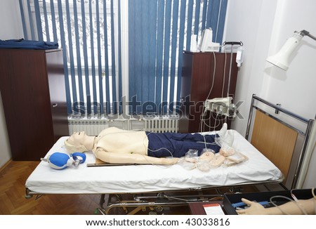 doll patient lying in hospital bed