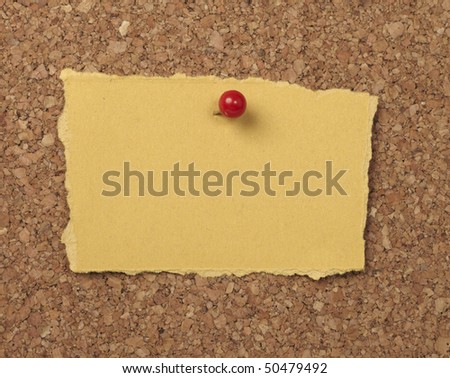 closeup of note paper  on cork board