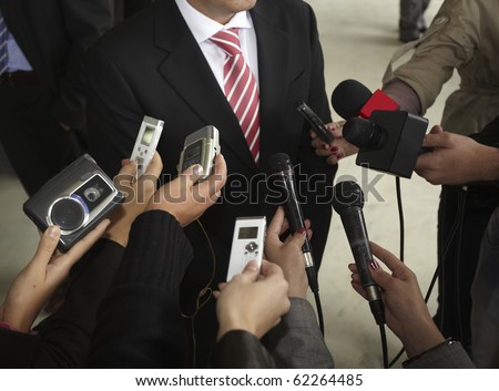close up of conference meeting microphones and businessman close up of conference meeting microphones and businessman