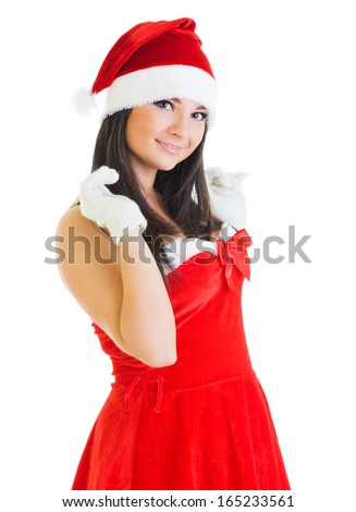Beautiful woman in masquerade fashion and santa hat. Isolated image