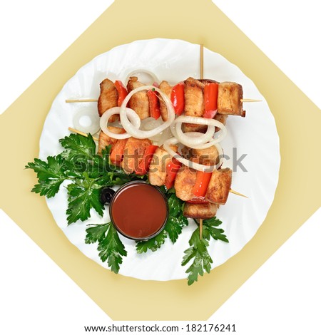 Dish of meat on skewer on white plate. Isolated image with white bckground. View from above. still life of setout table Russian cuisine