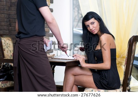 Woman is making the order in restaurant