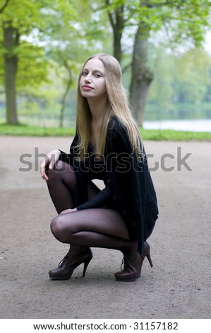 Portrait of the beautiful blonde girl on the nature