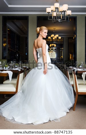 stock photo Beautiful bride in a wedding dress in the restaurant