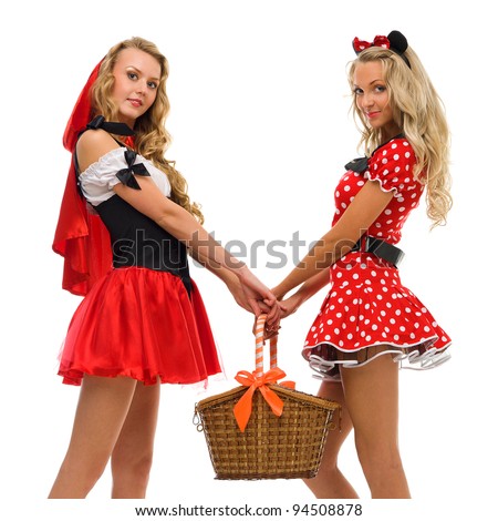 Two women in carnival costume.   Little Red Riding Hood and mouse shape. Isolated image