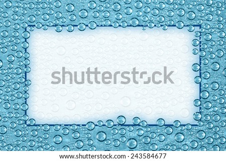 Blue Water Drops with Copy Space and Inner Glow. Water condensation forms a random pattern of circular drops of varying sizes. Blue Background with ghosted back copy space and inner glow.