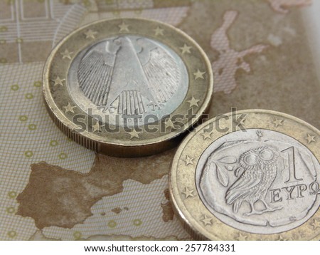 Greek and German euro coin -
Greek and German euro coin lying on the map of Europe a fifty euro note.