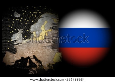Conflict Europe - Russia - A map of Europe against a black background, to the right - in the East- in a white spotlight the Russian flag