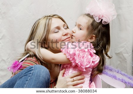 Mother And Daughter kissing