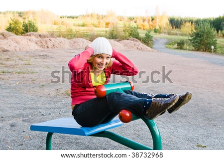 Young nice blond woman during fitness outdoor
