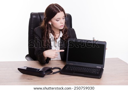 Business women show the laptop screen in the office