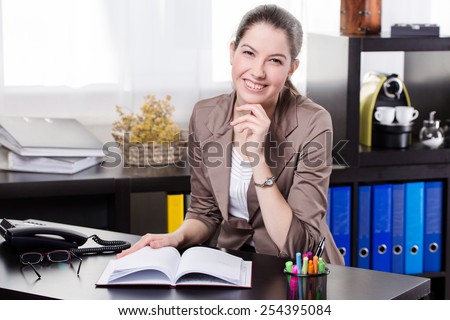 Elegant young and happy business woman work in the office.