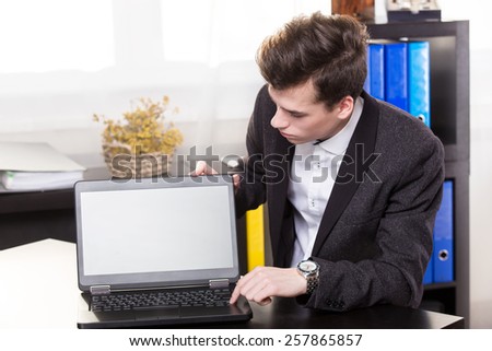 Business man show the laptop in the office