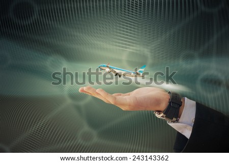 Image of business man with airplane flying out of his hand