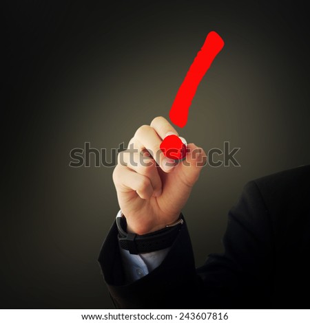 Business and advertisement concept. Close up of businessman drawing a exclamation mark