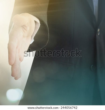 A young business man ready to shake hands