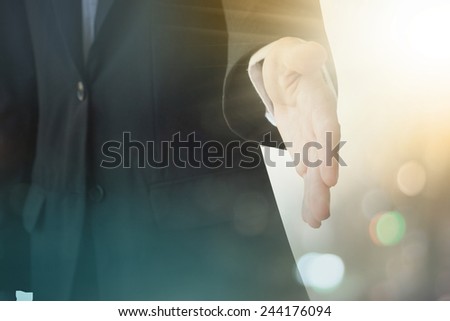 A young business man ready to shake hands